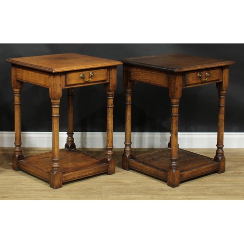 2110 - A pair of oak side or lamp tables, possibly by Titchmarsh & Goodwin, each with moulded top above a f... 