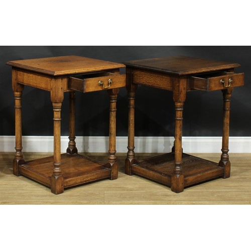 2110 - A pair of oak side or lamp tables, possibly by Titchmarsh & Goodwin, each with moulded top above a f... 