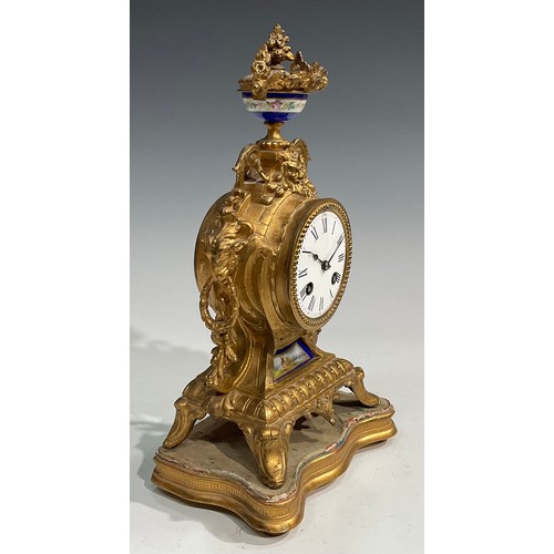 2433 - A late 19th century French gilt metal mantel clock, the movement stamped HP & Co, 7.5cm circular dia... 