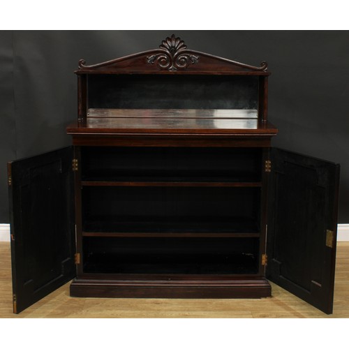 2513 - An early Victorian rosewood chiffonier, shaped superstructure with rectangular mirror, the base with... 