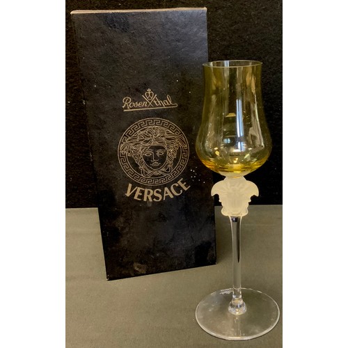 24 - A Rosenthal Versace wine glass, yellow glass bowl, frosted Medusa-head stem, 21cm high, boxed