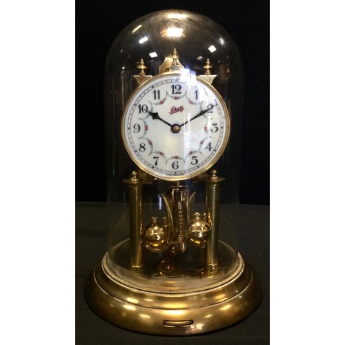 36 - A Schatz 400 day Anniversary clock, brass stand and glass cover, 30cm high