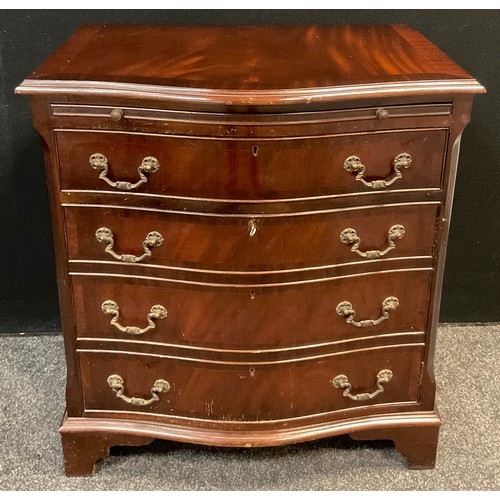 42 - A reproduction mahogany serpentine-front chest cabinet, brushing slide to top, above a single drawer... 