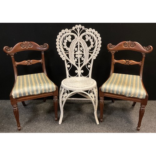 61 - An ornate woven wicker chair, 103cm high;  and a pair of Victorian carved mahogany side chairs, (3).