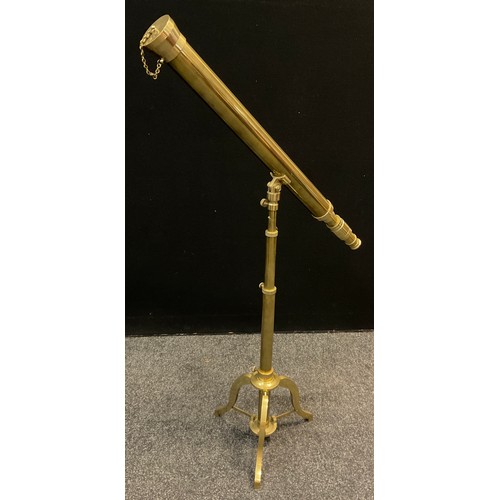 65 - A reproduction brass refracting telescope, 1.5” objective, length of main tube 57cm, adjustable bras... 