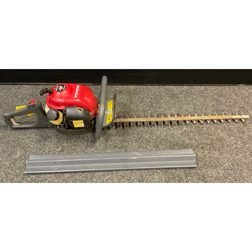 71 - A Honda HHH25 4-Stoke petrol hedge-trimmer.