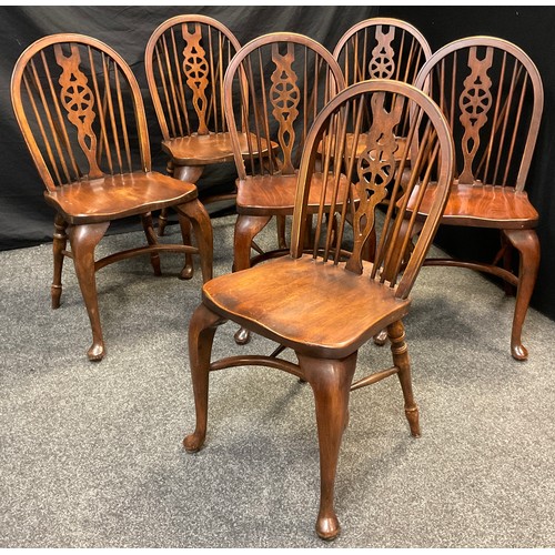 80 - A set of six Bevan Funnell stained oak and beech Windsor type chairs, spindle and wheel splat backs,... 