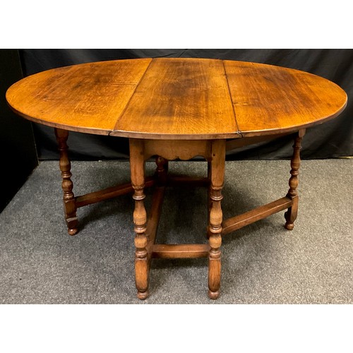 84 - A Titchmarsh and Goodwin oak gate leg table, model RL8, 74cm high x 137cm wide (leaves open), 41cm (... 