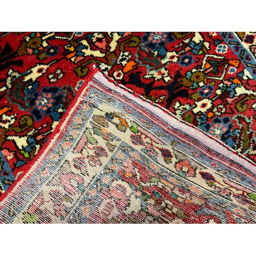 86 - A North West Persian Rudbar runner carpet, knotted with a dense stylised floral field, in shades of ... 