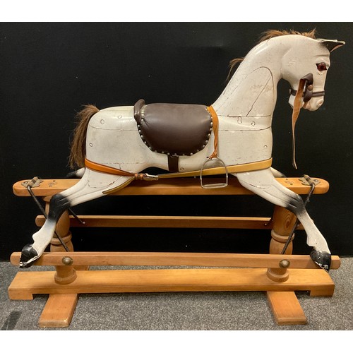 44 - A mid 20th century rocking horse, painted white, brown leather saddle, pine base, 106cm high x 137.5... 