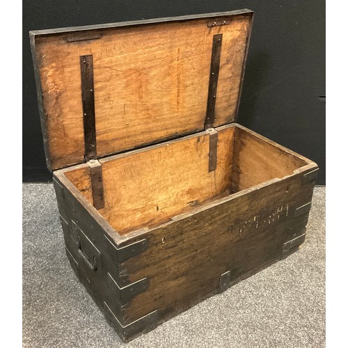 106 - A late 19th / early 20th century metal-bound hard wood secure chest, strap iron work to lid edge and... 