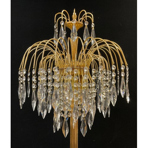 108 - A contemporary chandelier-top standard lamp, reeded brass upright, circular base 160cm high.