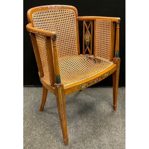 109 - An Edwardian Sheraton Revival painted satinwood armchair, Bergere weave back, sides, and seat, taper... 