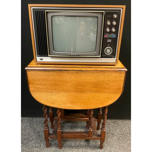 115 - A Vintage Sony Trinitron television / TV, solid state colour, 30cm screen;  drop leaf oak occasional... 