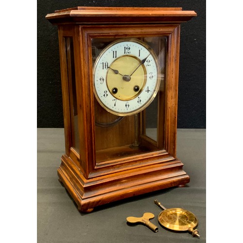 116 - A walnut cased mantel clock, by the Hamburg Amerikanische Uhrenfabrik (HAC) company, 8-day fusee mov... 