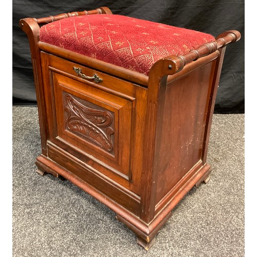 120 - A Victorian walnut piano seat, tilting door to front with sheet music rack, carved door panel, brack... 