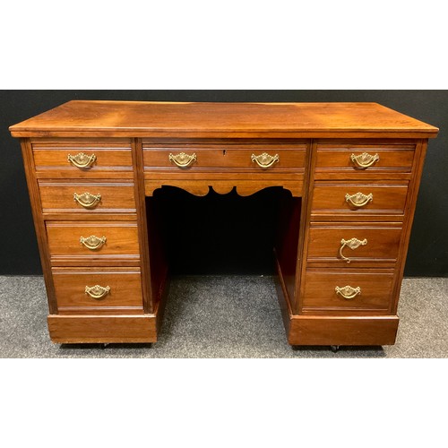 152 - An early 20th century mahogany pedestal knee-hole desk, four graduated short drawers to each pedesta... 