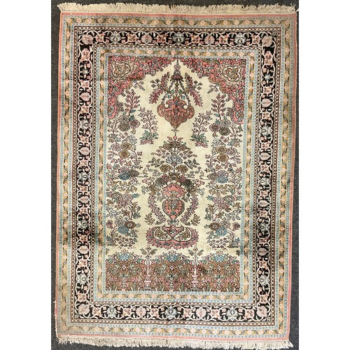 153 - A Persian Kashan silk carpet / rug, knotted with a central field as a stylised floral arbor and vase... 