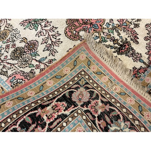 153 - A Persian Kashan silk carpet / rug, knotted with a central field as a stylised floral arbor and vase... 