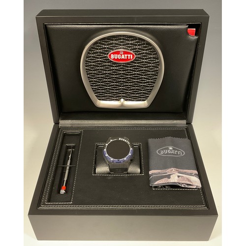 1009 - A Bugatti Ceramique edition one smartwatch, three interchangeable bezels, metal and rubber straps, c... 