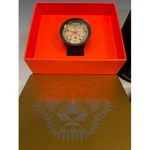 1063 - Swatch - two Tiger Power SB03Z102 wristwatches, each with gold tigers head bio ceramic dial, within ... 