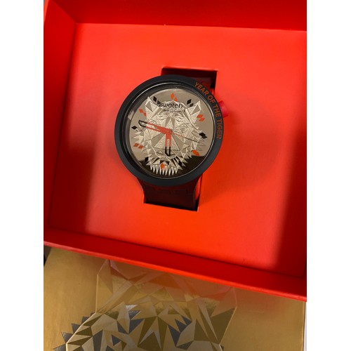 1063 - Swatch - two Tiger Power SB03Z102 wristwatches, each with gold tigers head bio ceramic dial, within ... 