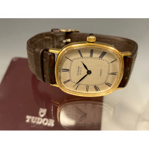 1085 - Rolex Tudor - Geneve Quartz wristwatch, oblong gold plated case, textured dial, black hands, Roman n... 