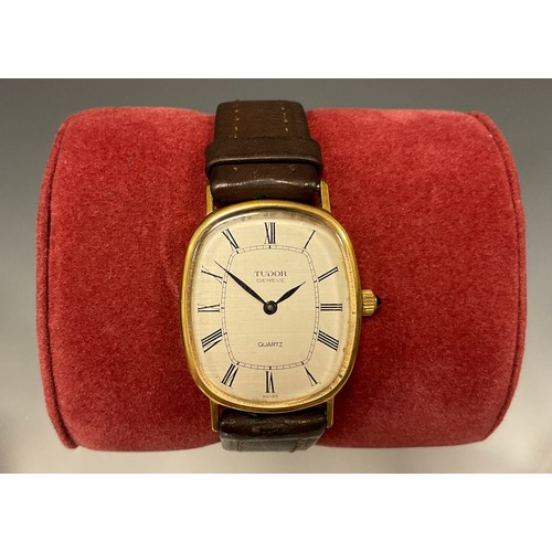 1085 - Rolex Tudor - Geneve Quartz wristwatch, oblong gold plated case, textured dial, black hands, Roman n... 