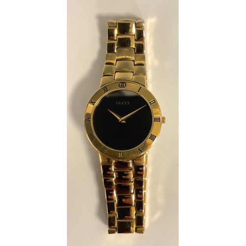 1133 - Gucci - 3300.2.M gold plated dress wristwatch, 32mm case, black dial, gold hands, Roman numeral beze... 