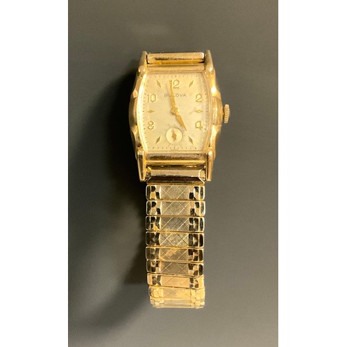 1050 - Bulova - a vintage gentleman's 10k rolled gold wristwatch, c. 1940/50, the shaped cushion case enclo... 