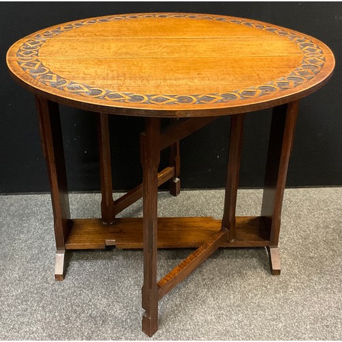 460 - An early 20th century carved oak gate-leg table, opening to a circular top, 76cm high x 91cm diamete... 