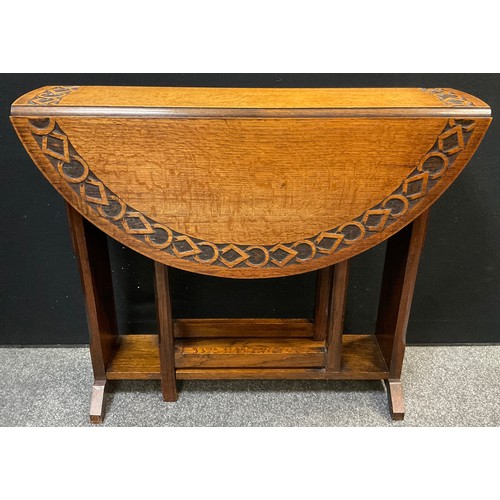 460 - An early 20th century carved oak gate-leg table, opening to a circular top, 76cm high x 91cm diamete... 