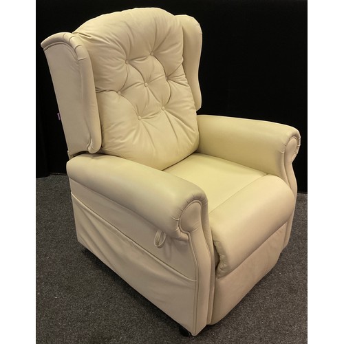 468 - An electric rise and recline armchair, cream leather, 116cm high x 91cm wide.