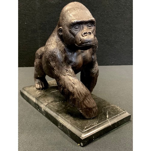 470 - A Bronze coloured metal figure of a Gorilla, marble base, 20cm long