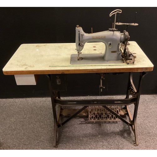 482 - A Singer electric sewing machine, no. ED299790, mounted on a cast iron treadle base.