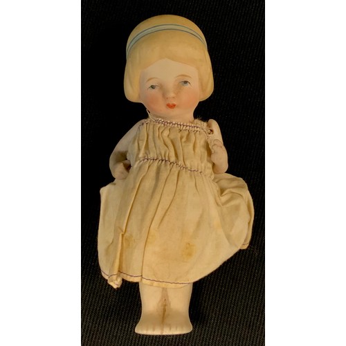 504 - An early 20th century continental porcelain doll, possibly Belgian, fixed body, articulated arms, pa... 