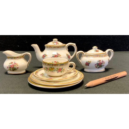 510 - A Coalport Miniature Ming Rose pattern bachelor tea set, comprising teapot, sugar bowl, milk jug, cu... 