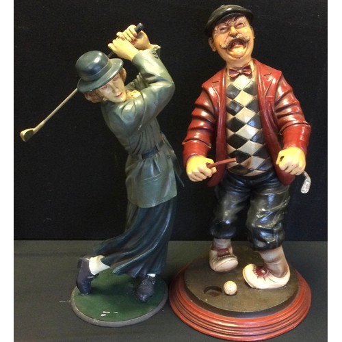 97A - A pair of large golfing figures - 