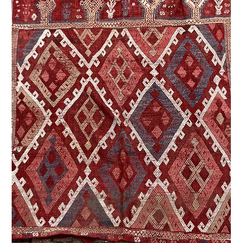 157A - ***BELONGS TO CARRADALE PAID OUT 05/06/24**A Persian Kilim type rug, or wall hanging, in tones of re... 