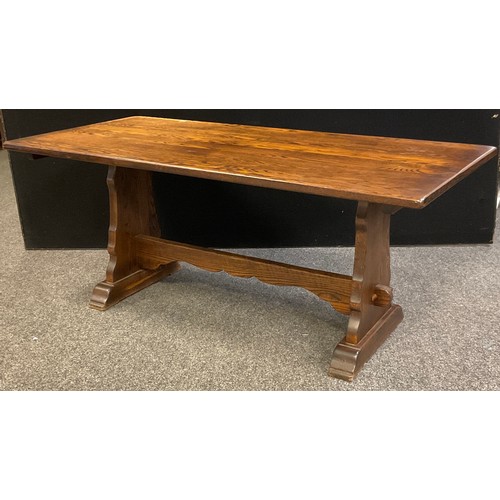 75A - An oak trestle dining table, 75cm high x 182.5cm x 84cm.