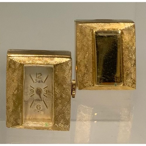 1119 - A pair of mid 20th century gold plated watch cufflinks, one with rectangular dial, 12,3,6,9 Arabic n... 