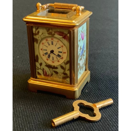 530 - Gilt miniature porcelain cartridge clock, key wind movement, 6x3.5cm