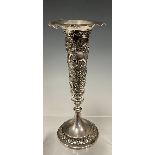 548 - An Anglo Indian silver coloured metal trumpet vase, embossed with exotic animals inc Elephant, Tiger... 