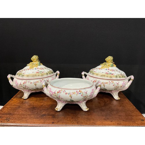 15 - A pair of porcelain fluted oval tureens and covers decorated in polychrome with birds and flowers, p... 