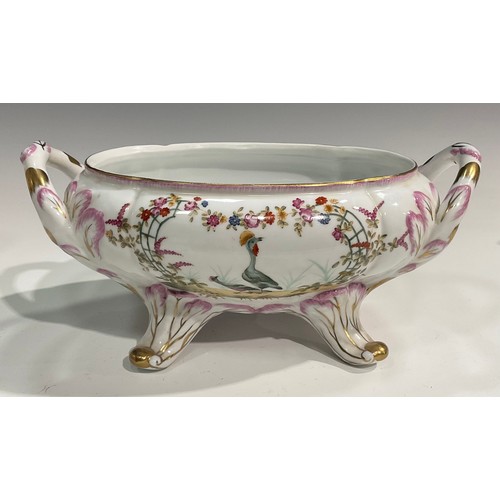 15 - A pair of porcelain fluted oval tureens and covers decorated in polychrome with birds and flowers, p... 