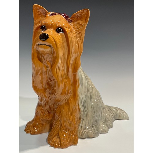 28 - A Beswick fireside model, of a Yorkshire Terrier, seated with ribbon, 26cm high, impressed mark, mod... 