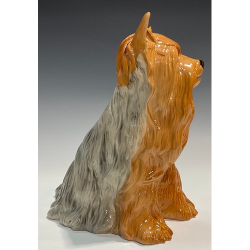 28 - A Beswick fireside model, of a Yorkshire Terrier, seated with ribbon, 26cm high, impressed mark, mod... 