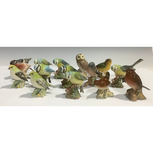 69 - A Beswick model, of a Tawny Owl; other Beswick bird models including Blue Tits, Wren, Wagtail, Goldc... 