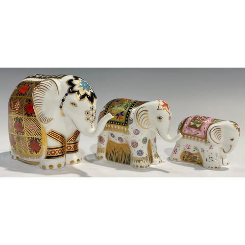 74 - A Royal Crown Derby paperweight, Elephant, printed in the 1128 pattern, trunk raised, gold stopper; ... 