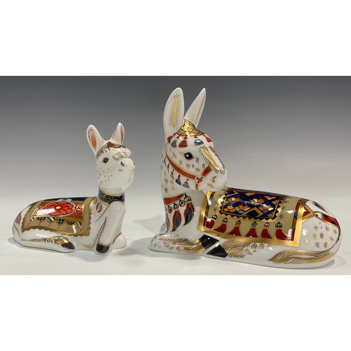 87 - An associated pair of Royal Crown Derby paperweights, Thistle Donkey, Govier's exclusive 2001 annual... 